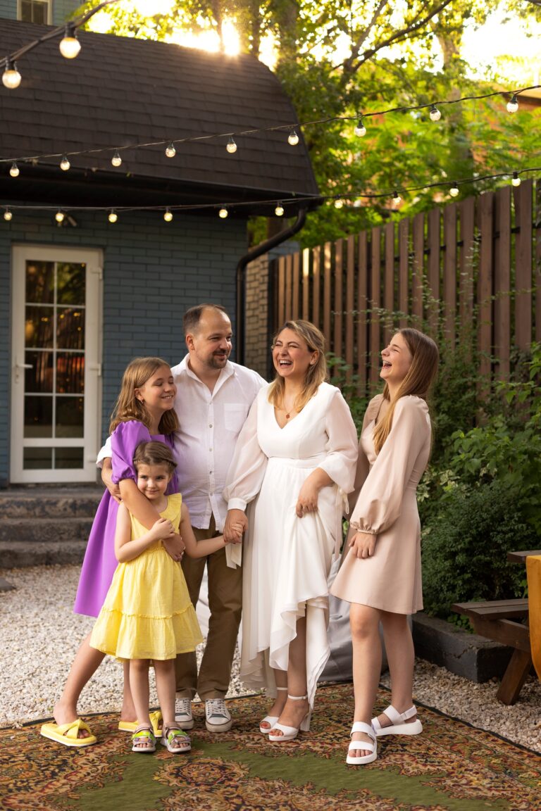 Photo of family on a wedding party for a 20 year anniversary in backyard party