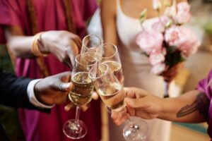 Toasting with Champagne glasses during wedding reception party