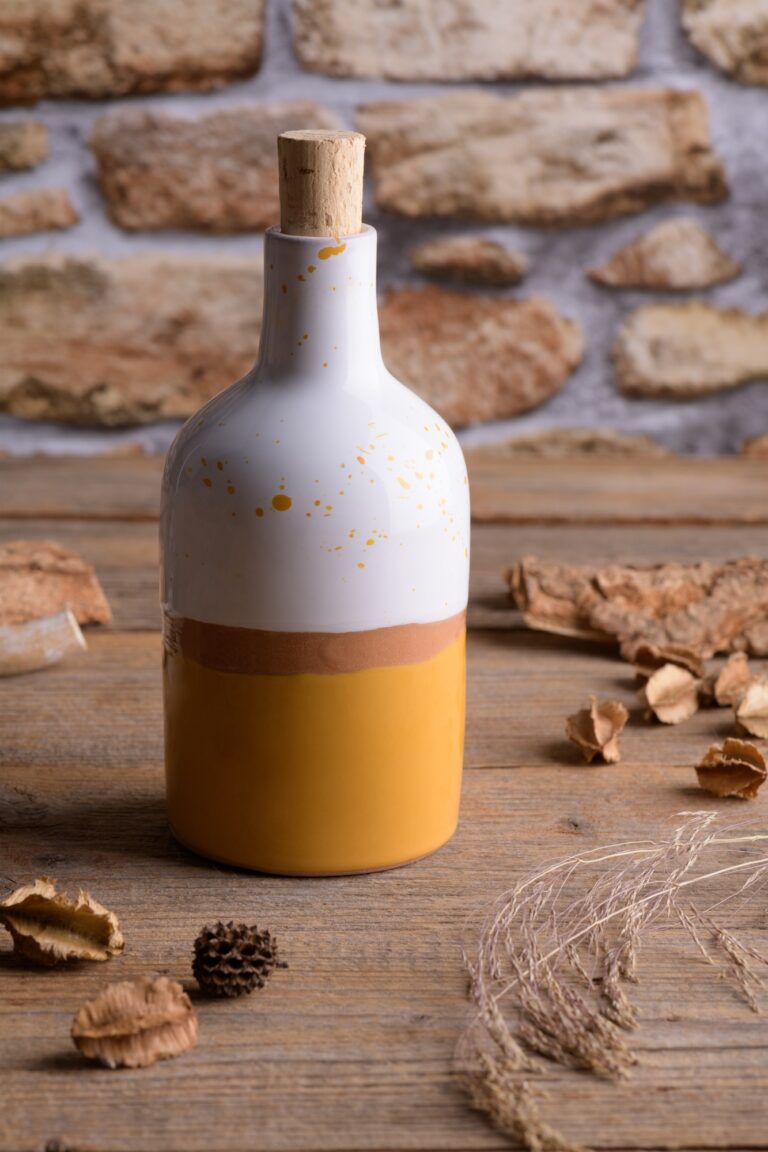 Ceramic bottle on a wooden table with boho decor, wedding gift for guest, wedding favors